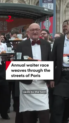 Armed with a tray carrying a coffee, water and a croissant, hundreds of Parisian waiters raced through the French capital Paris raising awareness of the quintessential role of 'The Cafe' in French culture. #france #paris #cafe #race #croissant