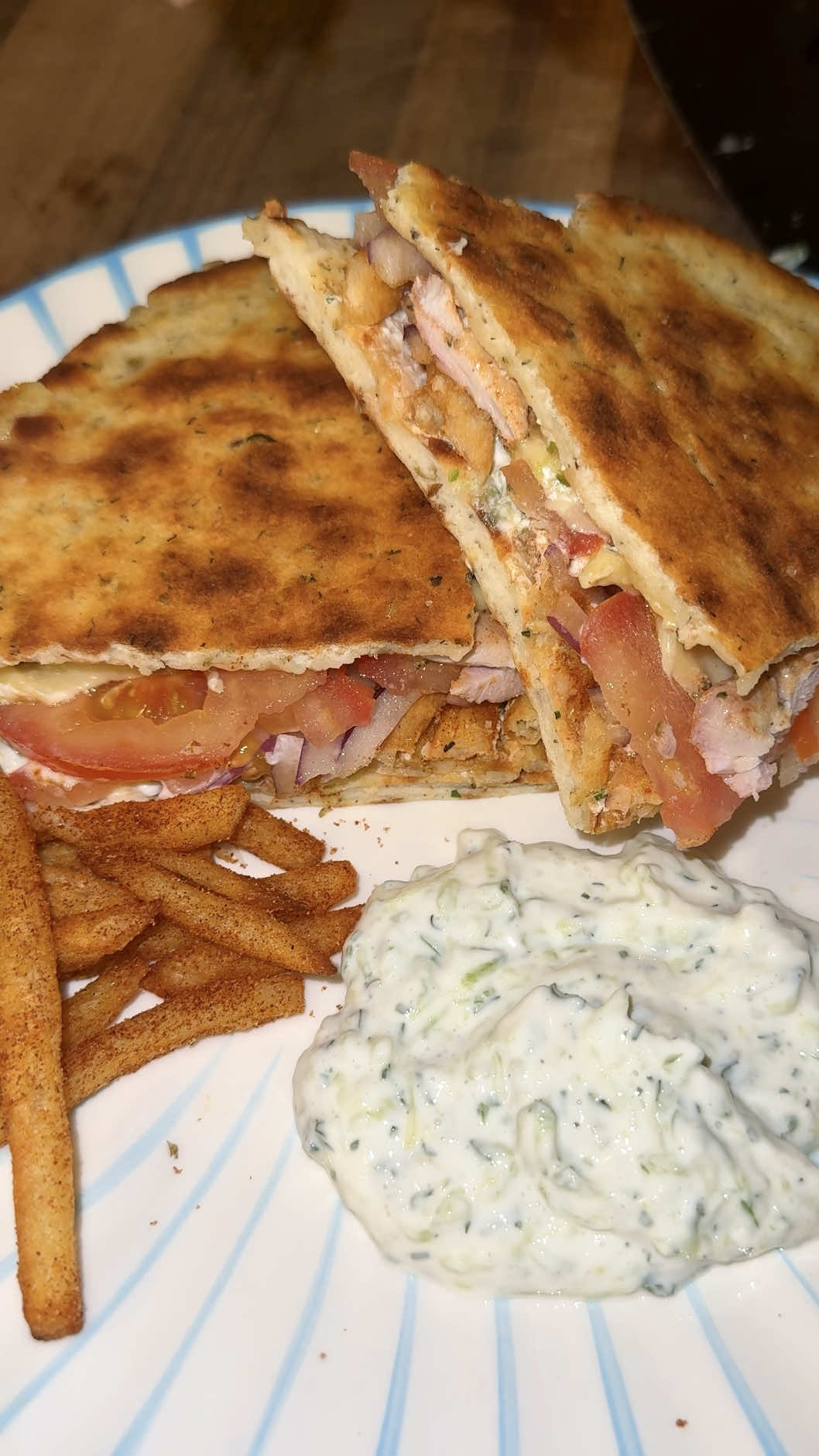 Replying to @larney2010 a healthier, higher protein take on it too x  Skepasti, the (better) sister of the beloved gyros. Enjoyed like a sandwich which means every bite is the perfect bite  It’s almost… ✨poetic✨  Anyway, do you believe me now?? Skepasti > Gyros, right?????  Makes 2 skepastis so serves 4 (Sharni and I shared one but who am I to judge if this will only serve 2 of ya’ll… I get it)  Spice blend:  2 tsp smoked paprika  2 tsp dried oregano  1 tsp garlic powder  1 tsp onion powder  1/2-1 tsp dried chili powder  Chicken:  500g chicken thigh fillet (or breast fillet), sliced  1/2 cup Greek yogurt  1/2 lemon, juiced  3 garlic cloves, freshly grated  1/4 cup fresh parsley, finely chopped  3/4 spice blend (listed above)  Salt and pepper  Tzatziki  1 cup Greek yogurt  1 garlic clove, freshly grated  1 Lebanese cucumber, grated & drained  1-2 tsp dill, finely chopped  2 tbsp fresh lemon juice  Salt and pepper  Flatbread  300g self raising flour  300g Greek yogurt  2 tsp dried oregano (optional)  Salt and pepper  Serve with: Shredded cheese  Tomato, sliced  Red onion, thinly sliced  Shoe string fries (airfield & tossed in remaining 1/4 of spice blend)  Full method breakdown available in my subs IG page xx  #gyr#gyrose#skepastiu#souvlakie#greekfoodnnerideas  