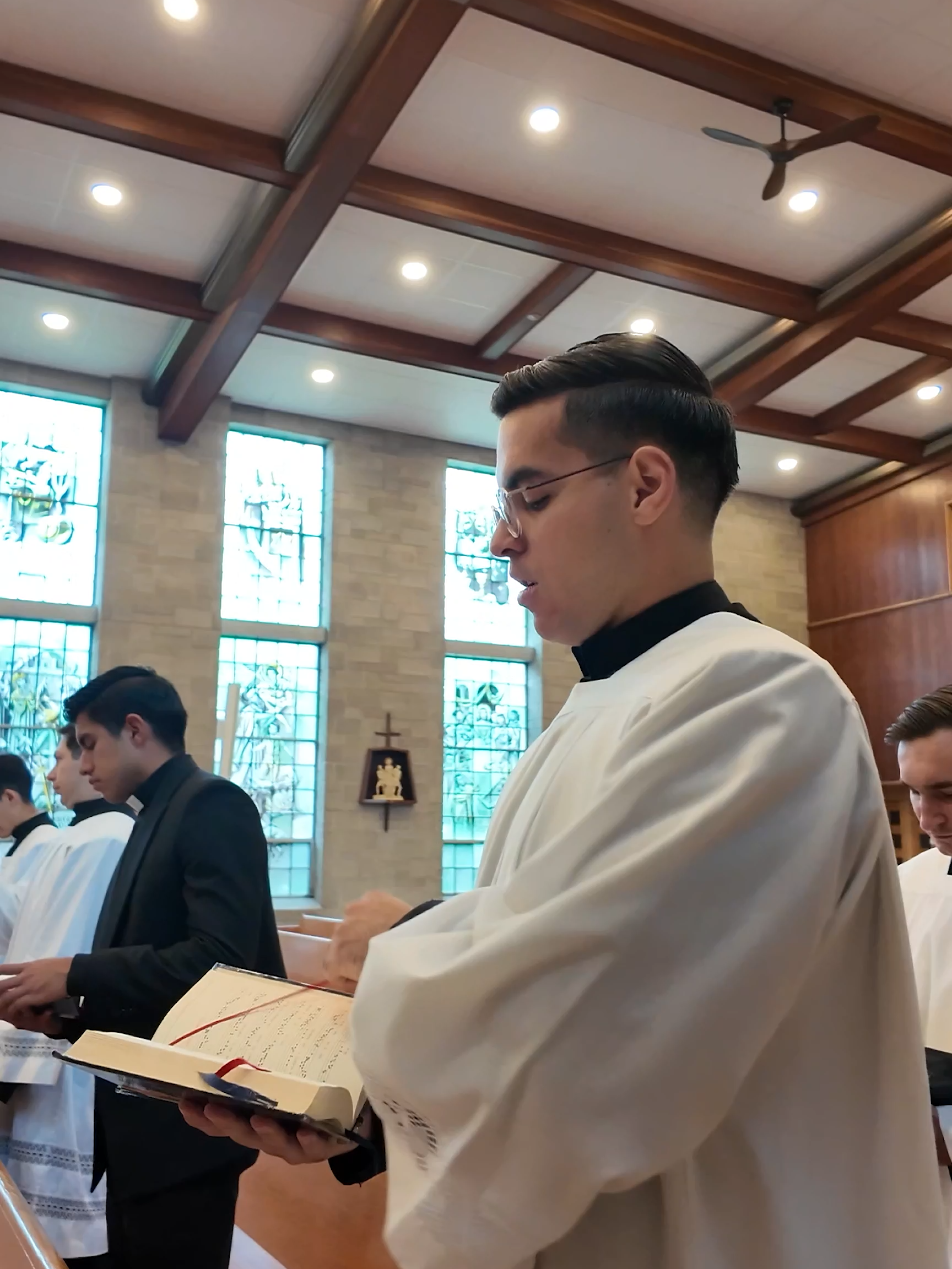 The Seminarians Sing Wearing Their Surplices at a Special Mass