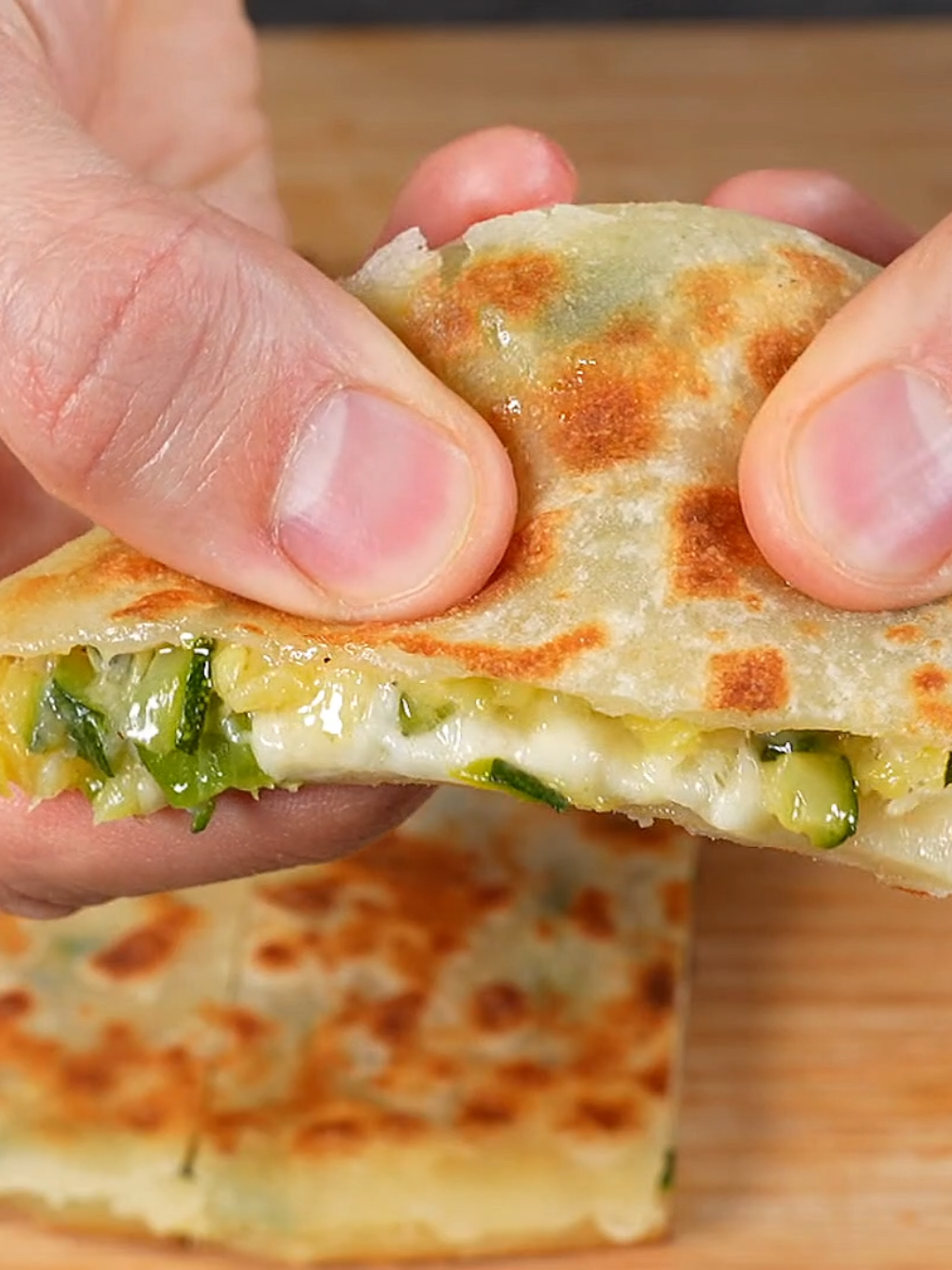 Try This Delicious Easy Stuffed Focaccia Bread. You only need a few ingredients! Ingredients: Flour: 300 g / 10 oz. Greek yogurt or plain unsweetened yogurt: 100 g / 3,5 oz. Milk: 150 ml / 5 fl oz. 2 medium zucchini. Grated cheese: 150 g / 5 oz. Salt. Black pepper. Cooking oil. Have fun replicating this Delicious Stuffed Focaccia Recipe! #fyp #cookingpan2 #tiktokfood 