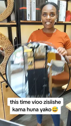 60cm round mirror with a leather strap @5000/=