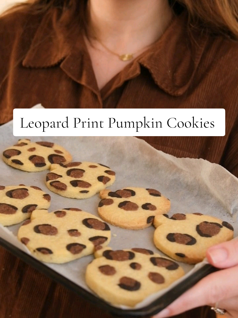 Leopard Print Pumpkin Cookies 🎃 It's officially the first day of Autumn so I thought I'd bring you two of my favourite things of autumn, leopard print and pumpkins. These are SO MUCH easier than they look and perfect to make with kids too. Recipe below 👇🏻  🥣225g plain flour 🧈150g baking butter, chilled  🍬75g sugar ⚫1 tsp black food colouring  🟤1 tsp cocoa powder  1️⃣In a bowl add the flour, butter and sugar and rub the butter into the mixture. This may take a few minutes but it will form a dough.  2️⃣Divide 1/4 of the dough off and spilt the 1/4 into two. Colour on half black with food colouring and the other half brown with cocoa powder.  3️⃣Roll out the plain dough to 1/2 inch thick between two sheets of baking paper. Add little blobs of brown dough and create small pieces of black around them.  4️⃣Gently flatten the pattern into the dough using baking paper and a baking tray to smooth over the dough.  5️⃣Once smooth use a pumpkin cutter to cut out shapes. You can reroll the dough as the leftover leopard print adds a marble effect and repeat until all the dough has been used.  6️⃣Place the pumpkins onto a lined baking tray and freeze for 30 minutes. After 30 minutes, preheat the oven to 180°c and bake the cookies for 8-10 minutes. Leave to cool before enjoying!  #halloweenbaking #autumnbaking #baketok #bakingtiktok 