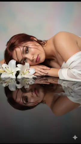 #gemiGEMINI💥 #gemin #fotografia  GEMINI💥 1:ENTRE NO GEMINI 2:COLOQUE SUA FOTO 3:COLE O TEXTO  Guy's sa gusto pong magpa edit eto po yung prompt A dreamy portrait of a beautiful woman lying gracefully beside white lilies, her head resting gently on her arms, is reflected perfectly on a glossy black surface. Soft cinematic lighting highlights her glowing skin and delicate facial features, with wet strands of hair framing her face. The mood is ethereal, romantic, and artistic, with a serene atmosphere, ultra-realistic, high-detail, professional studio photography, 8K.