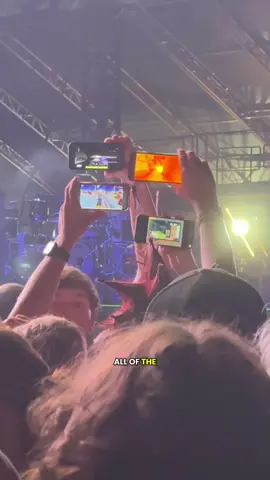 Brain rot videos have infected the pit at the blink-182 show at the shaky knee music festival in Atlanta, Georgia and I had to explain to the older people in the crowd what these videos of Family Guy and Subway surfer were why people were holding them up. #blink182 #shakyknees2025 #shakyknees 