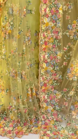 A dreamy canvas of floral artistry. This soft yellow saree is a masterpiece of intricate resham and bead embroidery, with a garden of pastel blooms coming to life across the delicate fabric. It's a perfect blend of modern elegance and timeless tradition, capturing the essence of a spring garden in full bloom. #SareeLove #IndianFashion #FloralEmbroidery #PastelSaree #Handloom     