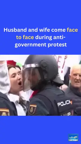 A husband and wife came face-to-face during an anti-government protest. The wife was making sure her husband and others around know she’s there while the husband seems awkward.  Netizens came up with many reasons why she’s there including the possibility that she’s there, because she wanted to spend more time@with her husband and found this as an excuse to do so 👀 #husband #wife #marriage #protest #antigovernment  