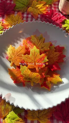 For me nothing screams autumn more than these cute little maple leaf cookies🍁🍂🐿️ they smell amazing in the oven with maple syrup and maple extract in the recipe!  [Maple leaf cookies🍁] 1 cup (2 sticks), unsalted butter at room temperature 1 Tbsp, maple syrup 1 cup, granulated sugar 3 3/4 cup, all purpose flour 1 1/2 tsp baking powder Pinch of salt 2 large eggs at room temperature 1 tsp maple extract Gel food coloring: red, orange, yellow, green 1. In a medium bowl, sift all-purpose flour, baking powder, salt and set aside. 2. In a large bowl, beat butter, sugar, and maple syrup until light and fluffy. Add one egg and maple extract and beat until incorporated. Add another egg and beat until incorporated. 3. Add prepared dry ingredients into wet mixture in two parts and gently mix until soft dough forms.  4. Divide dough into 4 pieces: red, orange, yellow, and green (I made more red and orange than yellow and green) 5. Mix different colored doughs into one bigger dough. Using colored doughs from instruction #4, I made 3 bigger mixed doughs.  6. Dust the surface and rolling pin with some flour and place the mixed dough onto the surface. Shape it into rough rectangle and roll until it is ~1/4” thick. Cover with plastic wrap and chill in the freezer for ~1 hour. 7. Cut out maple leaf shapes. Add the leaf detail with paring knife/butter knife (toothpick). Cover with plastic wrap and chill in the freezer ~30 minutes. (You can mix the scrap dough, roll out into 1/4” thick, and cut out more leaf cookies).  8. Meanwhile, preheat oven to 350F.  9. Bake the chilled cookies for 10-11 minutes at 350F. 10. Cool on the baking sheet for ~5-10 minutes. 11. Transfer the cookies onto cooling rack and cool completely. Enjoy!🍁🎃🍂 #foodtiktok #Foodie #fallbaking #mapleleafcookies 