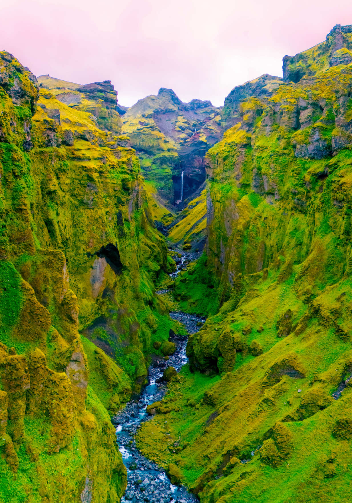 The most unique landscape on earth 🪐 This canyon in Iceland is absolutely one of the most stunningly beautiful places on this planet! Covered in lush plant life, filled with towering waterfalls, and topped off with a snow capped mountain peak… it doesn’t get much more incredible than this! Bonus points if you visit at midnight in the summer! 🔥 #travel #adventure #iceland #midnightsun #nature 