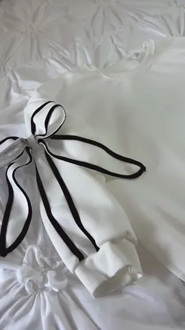 This is a definite fall essential this season. I am obsessed with this bowtie sleeve pullover sweatshirt. #sweatshirt #bowtiesleeve #giftsforher #fallfashion #pulloversweatshirt 