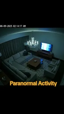Security camera footage shows paranormal activity in a living room at night #paranormal #fyp #scary #explore #haunted 