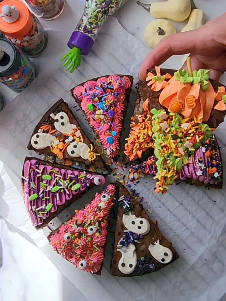 Spooky Brownie Slices!🎃🍫👻 Ingredients: 2/3 cup (130 g) granulated sugar 2/3 cup (735g) dark brown sugar 3 eggs, room temperature 1/2 cup (773g) unsalted butter 1 cup 1100 g) dark chocolate chips/chunks 1/4 cup (54 g) vegetable oil 2tsp vanilla 112 cup (75 g) all-purpose flour 1/2 cup (50 g) unsweetened cocoa powder 1 tbsp constarch 114 top salt 1/2 cup (50 g) dark chocolate Directions: 1. Preheat oven to 325 F. 2. Add the sugars and eggs to the bowl of stand mixer fitted with the paddle attachment; cream on high speed until light and fluffy. 3. Meanwhile, melt the butter by microwaving in heatproof bowl container at 30 second increments, stirring between each, then add the chocolate and stir until its fully melted and combined with butter. 4. Turn down the speed of mixer to lowest and add butter/chocolate mixture, oil, and vanilla. 5. Sift together flour, cocoa, cornstarch, salt, and add to wet ingredients while the mixer is still on low speed. Mix just untl combined. 6. Fold the 1/2 cup of chocolate with silicone spatula.Grease the 10 inch round silicone mold or spring form with nonstick spray, pour in the brownie batter and bake on middle rack for 35-45 minutes (until inserted toothpick comes out mostly clean) 7. Cool to room temperature before removing from the mold/ form, cut into 8 slices and decorate as desired. I used my carton egg whites Swiss Meringue Buttercream, recipe is on my blog. Enjoy!🍂 #spookyseason #halloweencountdown #halloweenaesthetic #spookytreats #halloweenfood 