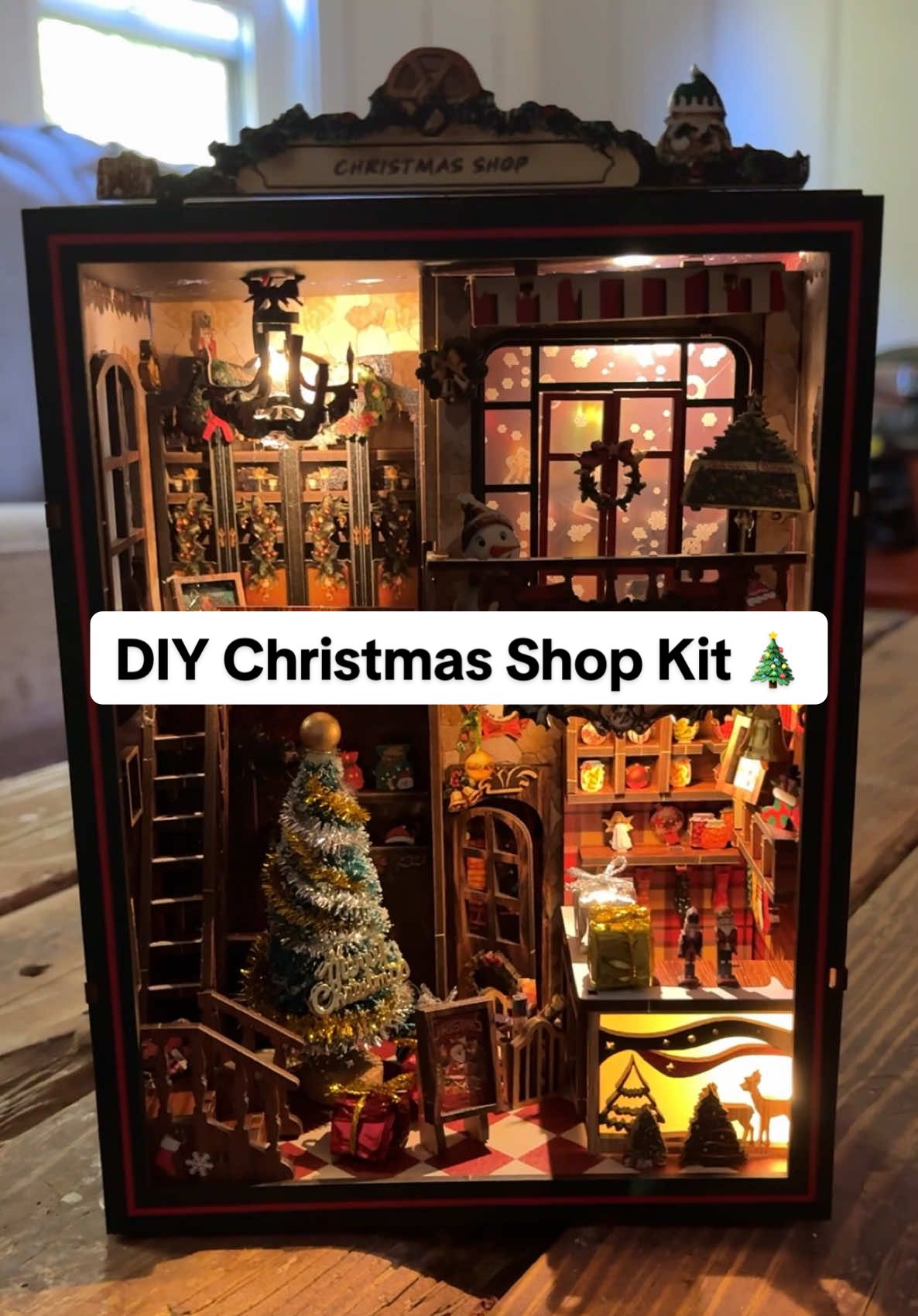 Create festive magic at home with this DIY Christmas Shop book nook kit. Eco-friendly wood, glowing lights, and nostalgic details make it the perfect holiday décor or heartfelt gift. #booknook #booknookdiy #christmasdiy #holidaydecor #tiktokshopcreatorpicks 