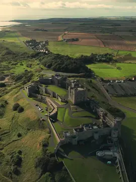 Bamburgh Castle is over 1,400 years old, with its origins dating back to the 6th century when it was the capital of the Anglo-Saxon kingdom of Bernicia. While the current structure has undergone significant renovations, particularly in the 19th century, the site itself has been occupied since prehistoric times, and a Norman keep from the 12th century still exists within the castle.   #england #castle #History #goldenbrown #medival 