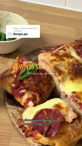 Replying to @Naomi Ashcroft  This pizza has become a classic in our house, something that feels complicated but is super simple and a big crowd pleaser!   Details below! Ingredients  500g Strong White Bread Flour  7g Yeast  6g Honey or Sugar  10g Salt  15g Olive Oil  420g Water   Pizza Toppings (optional)  Pizza sauce or tinned tomatoes blended with oregano, basil, salt and pepper  Fresh Basil  Pepperoni   Grated & Fresh Mozzarella  Hot Honey to finish  Method:  1. First mix your water, honey, salt, olive oil and yeast together and stir till well combined.  2. Then add your bread flour and mix until a shaggy dough is formed, cover and then leave for 15 minutes  3. After 15 minutes do your first set of stretch and folds. Pulling one corner of the dough up and folding it back on itself, turning the bowl until you’ve done four corners. I like to wet my hands when handling the dough, makes it a lot easier!  4. Cover and leave for another 15 minutes  5. After 15 minutes, perform your final set of stretch and folds and then leave, covered in the bowl for 1 hour and 30 minutes. Just on the counter at room temp.  6. While it’s proofing get your baking tray set up with baking paper and olive oil. Using a tablespoon or 2 to line the tray and paper so the dough doesn’t stick during the next proofing session or cooking time.  7. After the 1 hour and 30 is up, pour your dough into the baking dish, using a scraper to get the dough from the sides and release into the tray if needed. Then take 1 side, fold  it towards the middle, and then take the other side and do the same so they meet in the middle of dough. Then flip the dough so the sides from the folding are now on the bottom and the smooth side is face up. Cover and leave to rise on the counter for another 1 hour and 30 mins, could take 2 hours on a cold day! You’re just looking for it to have filled the dish and risen a little so it’s got a puffy top.  8. After this time, pre heat your oven to 200 degrees/gas mark 8 and then this is when the fun part starts! Cover your hands and the top of the dough with a little olive oil and begin dimpling. Don’t be scared to go deep, you should be dimpling enough to feel the bottom without tearing the dough.  9. Once bubbles start to appear and the top of the dough is covered in dimples then pop into the middle shelf of the oven for 15 minutes.  10. In this time, prep your toppings! For the pizza sauce we use a tin of chopped tomatoes and add to the tin your oregano basil, salt, pepper and then take a hand blender and slowly blend in the tin. Not necessary to do it in the tin but this keeps the tomatoes from being over mixed and going bitter.  11. Then after 15 minutes, take it out the oven and use enough sauce to just cover the top not completely soak it, add your cheese and any other toppings and then pop back in the oven for 20-25 minutes.  12. Once cooked, take out and leave for 2 minutes in the tray before transferring to a while rack to cool for 20 minutes.  13. I know it’s tempting but DO NOT slice until those 20 minutes are up as it is still baking in the tray.  14. Serve and top with fresh basil and hot honey if you like!  #foccacia #foccaciapizza #foccaciarecipe #howtomake #madefromscratch   