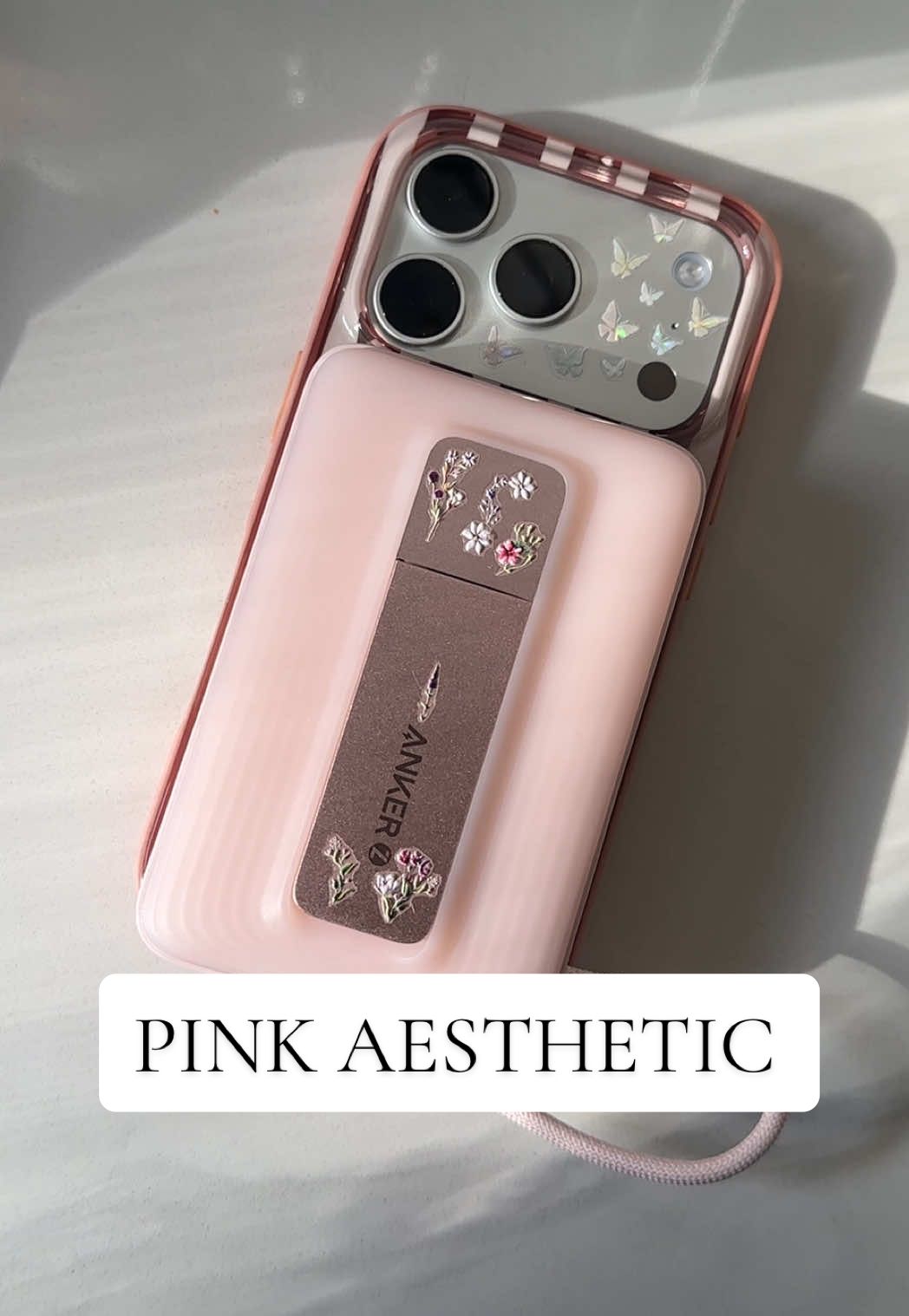 Anker comes in so many colors! Matching my every aesthetic! Thank you to whoever came up with the idea to put stickers on the back. #iphone17pro #iphoneaccessories #pinkiphone #aestheticphonecase #ankerzolo 