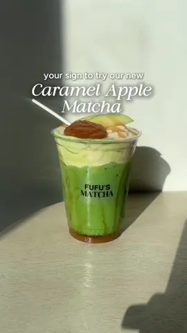 Welcoming fall with a new sweet treat! 🍏✨ Say hello to our Caramel Apple Matcha! It’s a cold-whisked matcha layered with green apple syrup, drizzled with caramel, topped with a caramel cream top, fresh apple slices, caramel drizzle, and a caramel apple lollipop.  It’s tart, sweet, and creamy. Perfect for the fall season. Available this week only! Stop by to get your fix. @Fufu's Matcha  #caramelapple #matcha #applematcha #matchalatte #mncafe #mnmatcha #bestmatchainmn #FufusMatcha #specialtydrink #seasonalmatcha #falldrink #newitem #greenapple #fyp 