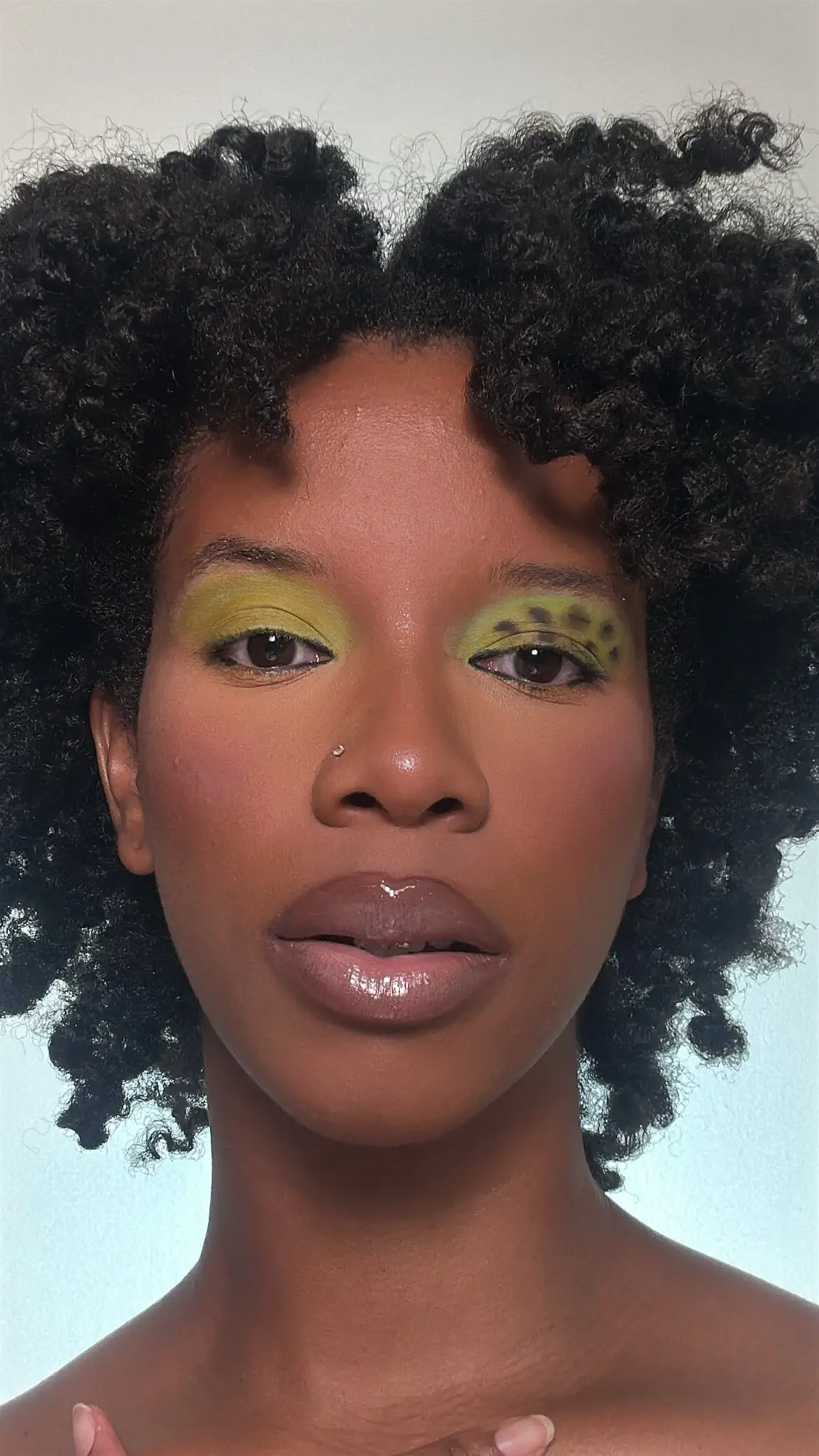 I had no intention of doing anything remotely like this. But once I realized I wasnt going to film any actual content and just play around on my face this is what happened. I kinda freaking love this happy accident. What do yall think? #editorialmakeup #funkyglam #glossylids #neongreeneyeshadow #redlips 