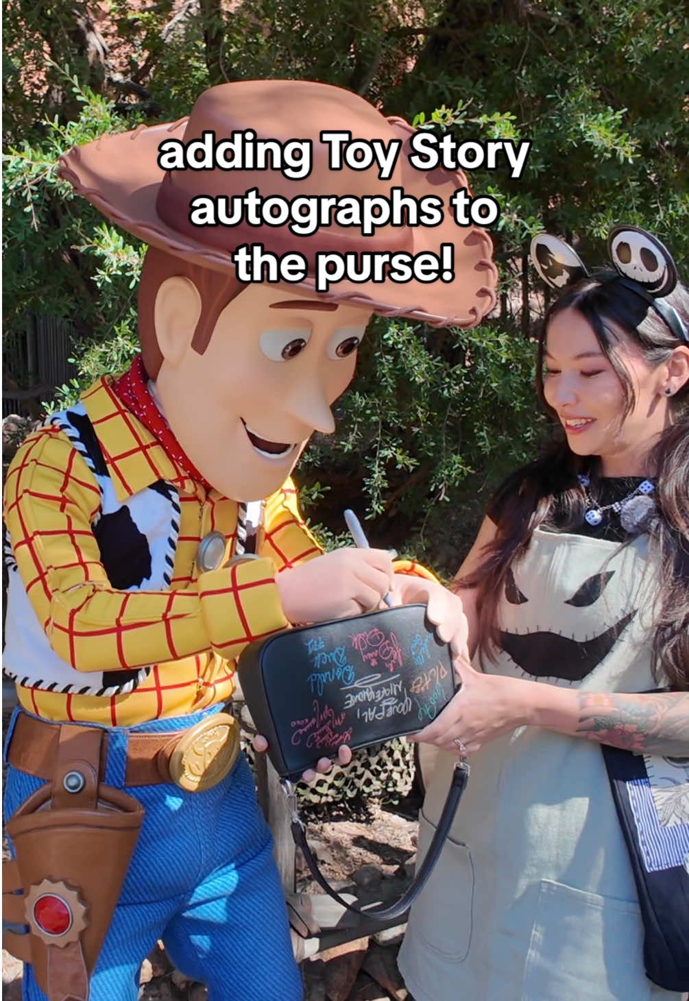 Replying to @-Kodi- Having Woody and Jessie sign the Disneyland autograph purse! ❤️ #disneyparks #disneyland #toystory #disney #disneystyle @Disney Parks 