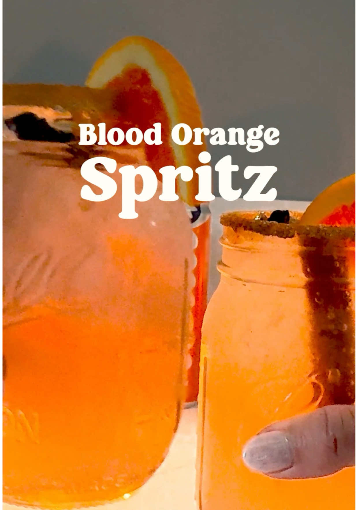 🍂 Enjoy the spritz of the season - a vibe-infused Blood Orange Spritz🍊 ​ ​  RECIPE: ​ ✨2 Blood Orange Delta Seltzers​ ✨24oz NA Blood Orange Ginger Beers​ ✨Ice ✨Cinnamon Sticks​  ✨Blood Orange Slices  ✨Cinnamon Sugar (for the rim 😉) #mocktail #fallaesthetic #itsfallyall #autumnaesthetic #fallvibes  