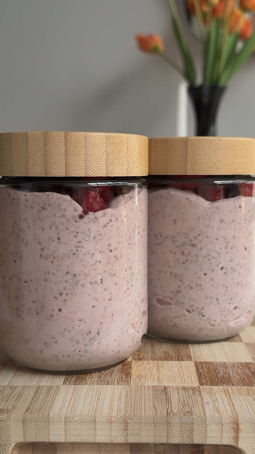 BLENDED RASPBERRY PROTEIN CHIA PUDDING This makes 3-4 servings  Ingredients 1 cup frozen raspberries 1 1/2 cups unsweetened vanilla almond milk 1/4 cup sugar free maple syrup (or any sweetener of choice) 1/2 cup chia seeds 2 scoops vanilla protein powder  Toppings: fresh raspberries and chocolate chips   Instructions: 1. Add raspberries, almond milk, and maple syrup to a blender and blend until smooth.  2 Then add chia seeds and protein powder and blend again on high speed until it starts to thicken into a pudding like texture. This may take some time!  3. Evenly distribute amongst 3 glass jars then top with raspberries and peanut butter and store in the fridge for up to 4 days.  #healthyrecipes #chiapudding #healthybreakfast #mealprep   