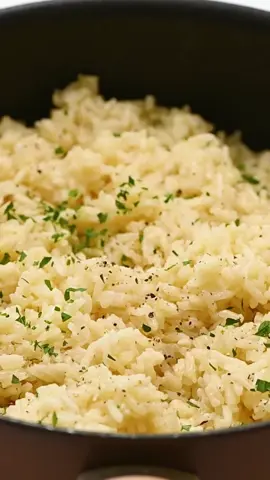 All you need to whip up this delicious garlic butter rice is a handful of simple ingredients. This rice is a great side dish to any dinner! #DinnerIdeas #EasyRecipe #butter #ricedish #cooking. Recipe linked in my bio.