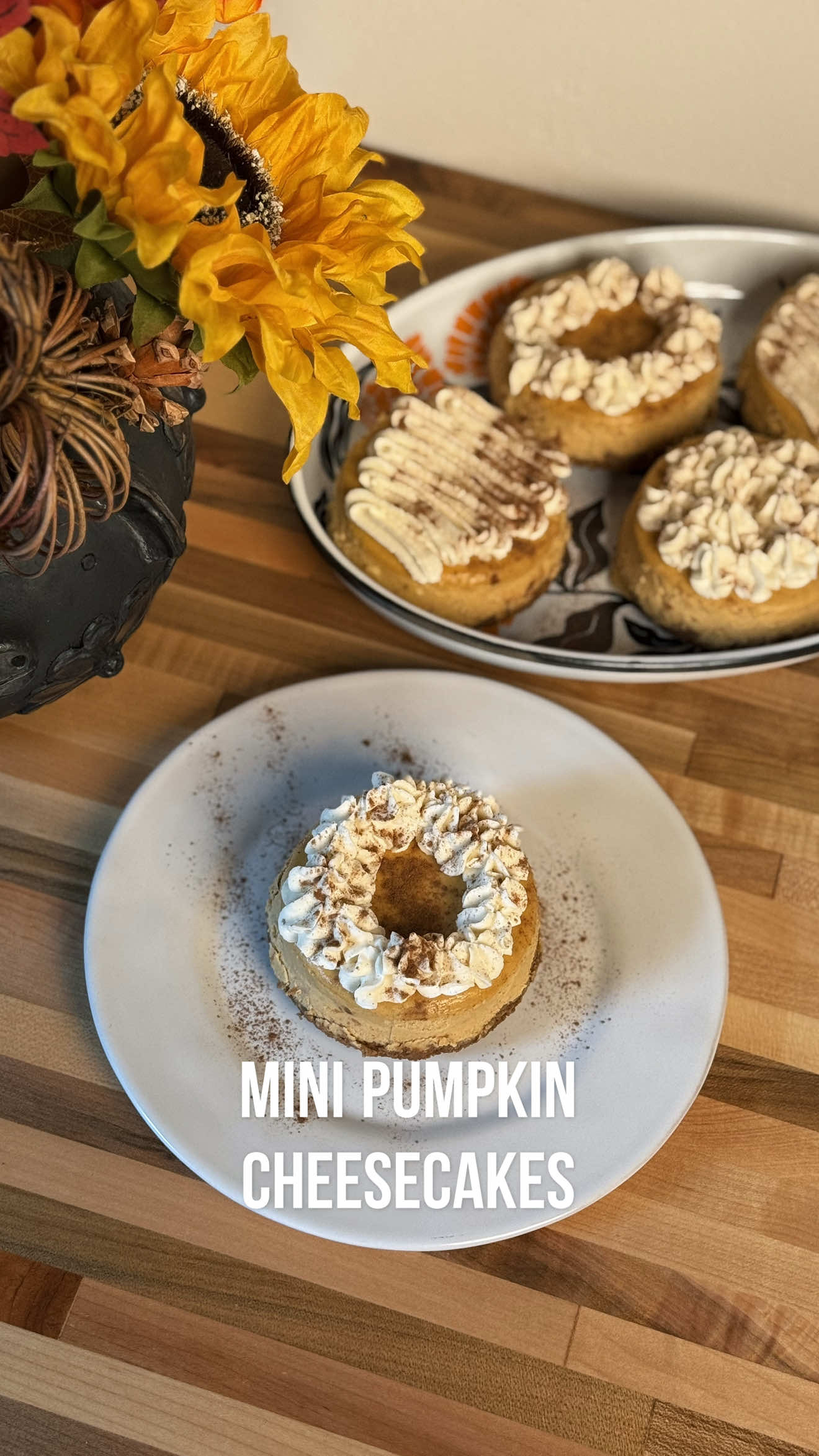 These little treats are made with a sweet + spiced crust and a pumpkin cheesecake filling that’s rich, velvety, and perfectly seasonal. They’re the kind of dessert that disappears fast at our holiday table. Mini Pumpkin Cheesecakes 👇🏼 Crust Ingredients: 4 Cups of Crackers  1 Tsp Pumpkin Pie Spice 6 Tbsp Salted Butter Pumpkin Cheesecake Filling Ingredients: 24oz Cream Cheese  3/4 Maple Syrup (or to taste) Pumpkin Pie Spice 14 oz Pumpkin Puree 1/4 Cup Greek Yogurt  Splash of Vanilla Extract  3 Eggs 1 Tsp Cassava Flour Pinch of Salt For this series, some recipes will be filmed outdoors over the fogón, while most will be made in my kitchen so I can give you accurate oven temps and cook times. That way, you can start practicing now and build your holiday menu with me 🧡 Would you try one? 😋 #mexican #holiday #cheesecake #healthy #Recipe 