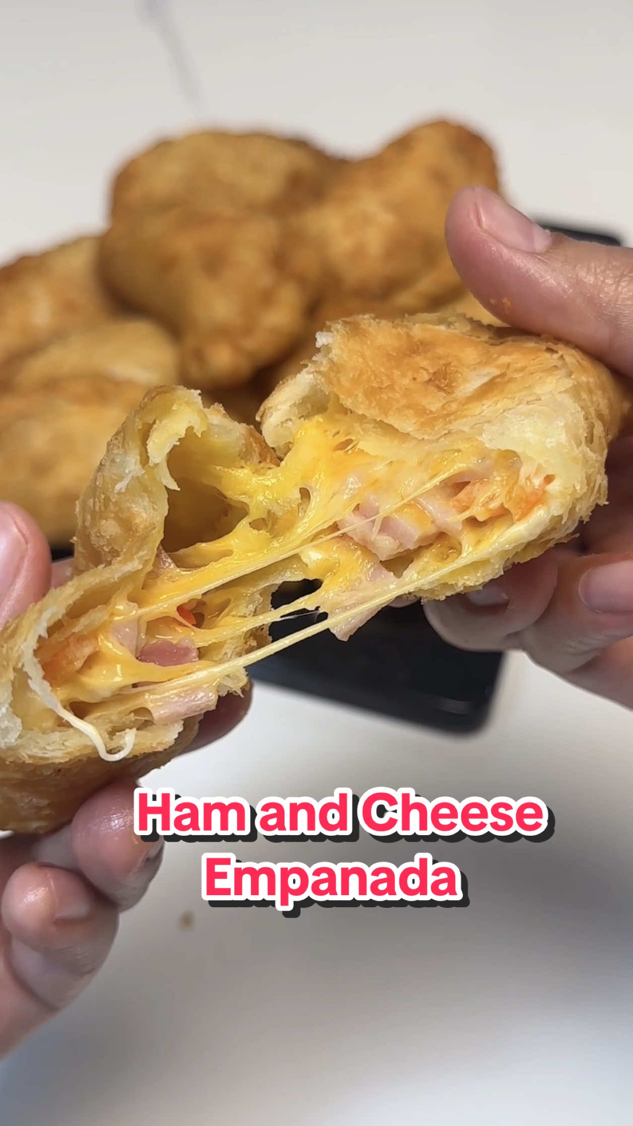 Ham and Cheese #empanada No Bake #Recipe ⤵️ ✔️Dough 3 cups all purpose flour (405g) 1 tbsp sugar (12g) 1/2 tsp salt (3g) 3/4 cup cold unsalted butter (170g) 3/4 cup cold water (180ml) ✔️Filling 250 grams ham (cut into small squares) 200 grams cheese (shredded) 80 grams bell pepper (chopped) 80 grams mayonnaise Procedure: 1. In a mixing bowl, combine the flour, sugar, salt and cold butter (cut into cubes). Rub the mixture together by hand until well combined into crumbs. Add-in the cold water gradually. Mix thoroughly by hand until dough forms. 2. Wrap the dough in plastic then chill / refrigerate it for at least 1 to 2 hours. (For faster chilling, it can be placed in freezer for about 30mins.) 3. Prepare the filling by combining the ham, cheese, bell pepper and mayonnaise. Set aside until ready to use. 4. Roll out / flatten the chilled dough (approx. 3mm thickness). Cut the dough into circles using 5-inch round cutter. Roll out again the excess dough to shape more into circles. This yields 18 pcs. Or you may cut the dough on your preferred size / quantity. 5. Place the filling in the center of each dough circles. Fold over the dough like a half-moon shape then firmly press the edges to seal. Crimp the edges by pinching then pressing with finger or just simply press with fork. 6. Deep fry the empanadas in oil until golden brown.  #pastry #cooking #food 