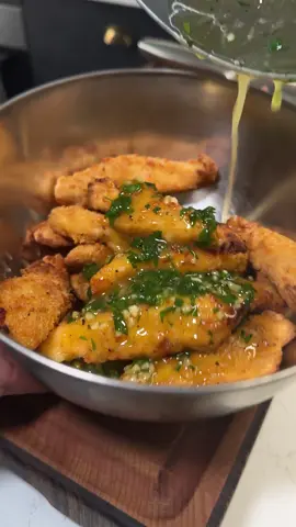 Garlic Butter Chicken Tenders Serves: 2 Prep Time: 5 mins Cook Time: 20 mins Ingredients 	•	8 frozen chicken tenders 	•	50 g (about 3 tbsp) unsalted butter 	•	3 cloves garlic, finely minced (or 2 tsp garlic paste) 	•	1 tbsp runny honey 	•	2 tbsp fresh parsley, finely chopped 	•	20 g Parmesan cheese, shaved or grated (optional garnish) 	•	2 rashers streaky bacon, cooked until crispy & crumbled (optional garnish) 	•	Salt & pepper, to taste Method 	1.	Cook the chicken tenders: 	•	Oven: Bake from frozen according to packet instructions (usually 180°C fan / 200°C oven for 18–20 mins). 	•	Air fryer: Cook at 200°C for 12–15 mins until golden and crisp. 	2.	Make the garlic butter sauce: 	•	In a small pan, melt the butter over low heat. 	•	Add the garlic (minced or paste) and cook gently for 1–2 minutes until fragrant, not browned.
