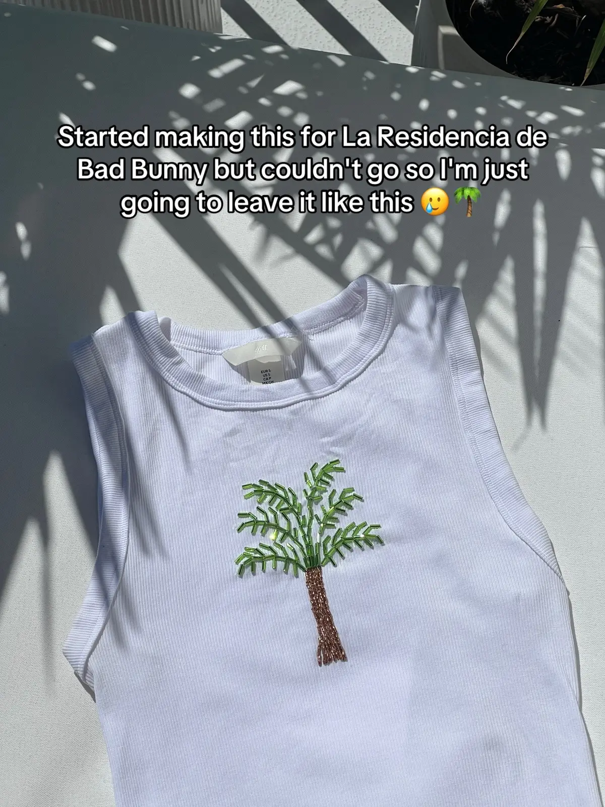 I had been wanting to make a palm tree beaded top and then saw @alix_creations make one inspired by the DTMF album cover and had to recreate it. Now I'm too sad about missing the residency to finish it 🥲 Maybe I'll add the bananas and chairs before I see him on tour 🤣  #beadembroidery #beadedtop #badbunny #laresidencia #badbunnypr 