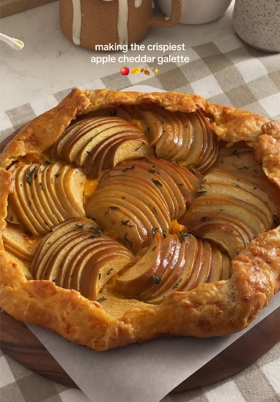 APPLE CHEDDAR GALETTE 🧀 cheddar cheese and tart apples brushed with thyme butter and wrapped in a crispy and flaky cheesy pie crust! and it’s also the first savoury recipe i’ve ever made for you!!! 🫨 for when you want to make something fall-coded but not a sweet treat! (you should also make the sweet treat though) recipe linked in my bio or search “apple cheddar galette” on teakandthyme.com 🫶 #galette #applegalette #fallbaking #baking #fallrecipes 