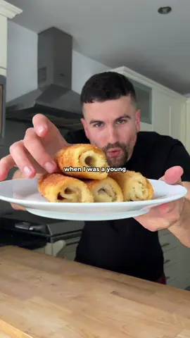 My childhood favourite snack. Crispy savoury pancakes with a ham and cheese filling 👌 If you want the full recipe for the crepes themselves, then head to my recipe app or Substack - both linked in my bio 🍽️😌    Ingredients: - crepes  - cheese slices (vegan) - ham (vegan) - plain flour - breadcrumbs (I used panko) - vegetable oil for frying For the wet batter mix: - 2 cups soya milk (unsweetened) - juice from 1/2 a lemon - 1/2 tsp smoked paprika - 1/4 tsp garlic powder - 1 tbsp flour - pinch of salt   Place one slice of cheese and ham in the middle of a crepe, fold over the sides and bottom, then roll it over tightly. Do this for as many crepes as you want and set them aside on a plate.   Prepare your coating station by adding plain flour into one bowl, the wet batter mix into another bowl, and the panko breadcrumbs to another bowl - Use as much plain flour and breadcrumbs as needed to coat your pancake rolls.   Coat the rolls in plain flour, then wet batter, and then breadcrumbs, making sure each roll is coated evenly.   Shallow fry in vegetable oil over medium to high heat until all sides are crispy and golden brown.   Once cooked, sprinkle a little salt over them and allow to cool. Serve with your choice of dip and enjoy!   #pancakes #comfortfood #recipes #crepes 