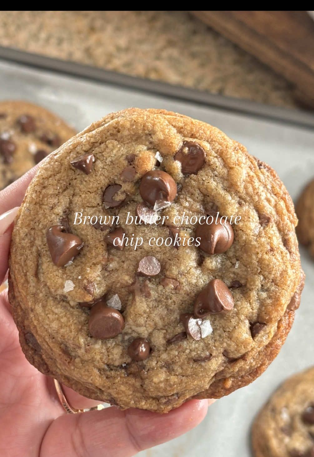 Let’s bake!!! 🍪 Brown butter chocolate chip cookies  1/2 cup brown sugar  1/4 cup white sugar  1/2 cup browned butter  1 egg 1 egg yolk 1 tsp vanilla bean paste (vanilla extract works great too) 1/2 tsp instant espresso or instant coffee 1 cup flour  1/2 tsp baking soda 1 tsp corn starch 1/4 tsp salt 1/2 cup Semi sweet chocolate chips  1/2 cup Mini some sweet chocolate chips 1 chocolate bar chopped up in pieces Let brown butter cool for 15-20 min And then cream brown butter and sugars. Add egg mix, then add vanilla paste. In another bowl add flour, baking soda, corn starch and salt add espresso powder and mix until combined. Add dry ing to wet ingredients and fold until just combined. Fold in your chocolate (do not over mix) chill for 20-30 minutes and bake at 350 degrees for 9-10 minutes, let them finish baking on the counter and top with more chocolate chips :) this makes a difference. After 10 minutes place them on a wire baking rack and enjoy 🩷 #asmrbaking #asmrvideo #asmrtiktoks #jenmagic #brownbutterchocolatechipcookies 