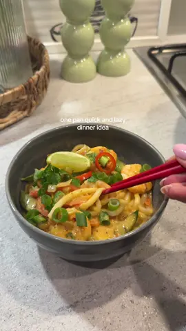 if your feeling lazy, make this one pan prawn red Thai curry noodles, So tasty, easy and quick to make 🍜🍴  Ingredients: • prawns  • udon noodles  • coconut milk • soy sauce  • brown sugar  • red pepper  • mangetout  • garlic clove  • white onion  • red Thai curry paste  • spring onion • fresh parsley • chilli’s  • lime  1. In a on add some fresh garlic, diced white onion and cook for 2-3 minutes  2. Add some red Thai curry paste, 200ml coconut milk, soy sauce and squeeze of lime and mix together  3. Then add a sprinkle of brown sugar and all your veg I’ve used mangetout, red pepper and prawn, mix together and let this cook for 5-6 minutes to let the prawns cook 4. Finally add some udon noodles cook as per packet instructions usually 1-2 minutes and then add to a bowl, topping with fresh parsley, spring onion, red chillies and lime  enjoy 🫶🏼 #onepandinner #redthaicurry #noodlesrecipe #noodlerecipe #DinnerIdeas 