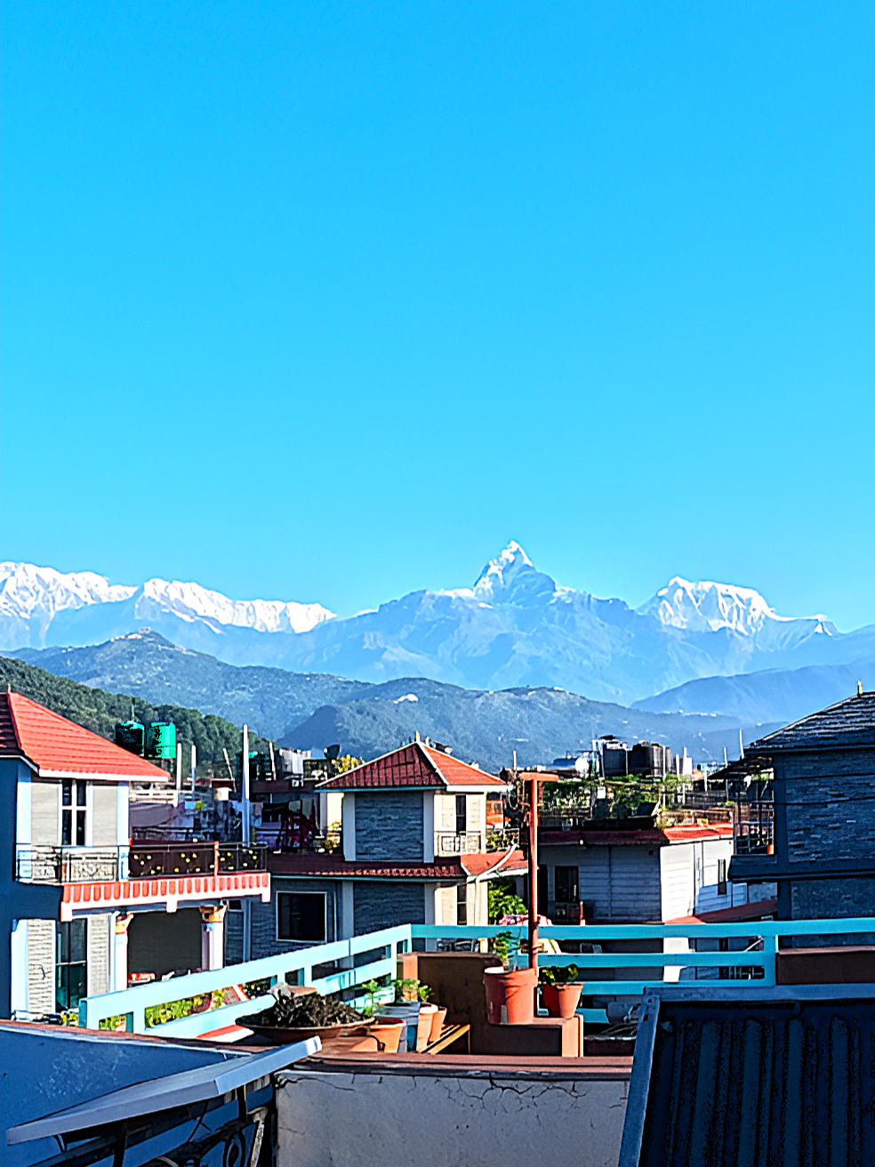 “Pokhara mornings from the rooftop 🌄✨ City waking up, blue skies above & snowy peaks shining bright 🏔️💙 #Pokhara #MorningVibes #NepalBeauty #MountainView” #fypp