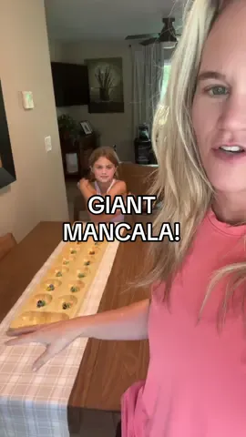 When you can’t find something you want in the stores, find a skilled craftsman and ask them if they can make it for you!   🙌🏼Thank you so much to @Timber Trail Designs for my custom made GIANT Mancala board.  — STORY TIME BELOW 👇🏼 — As a kid, my summers were simple: ☀️ Days at the public pool, somehow becoming besties with every lifeguard. 🎨 Hours at the Park & Rec shelters, making luster lace keychains and playing on GIANT Mancala boards. Sure, you can buy Mancala at a store… but nothing beats the rush of scooping up marbles on a board so big you could practically sprint across it. That memory? Forever stuck in my brain. Years later, I finally had a custom board made—and it’s even more beautiful than I imagined. Huge thanks to Timber Trail Designs for bringing a piece of my childhood back to life. 💛 I can’t wait to pass this joy on to my girls. Our board will live on the table all year, a little reminder of sun, laughter, and those perfect, endless summer days. Have you tried Mancala? You might just feel 10 again. #timbertrialdesigns #mancala #marblegame #nostalgic #custommade 