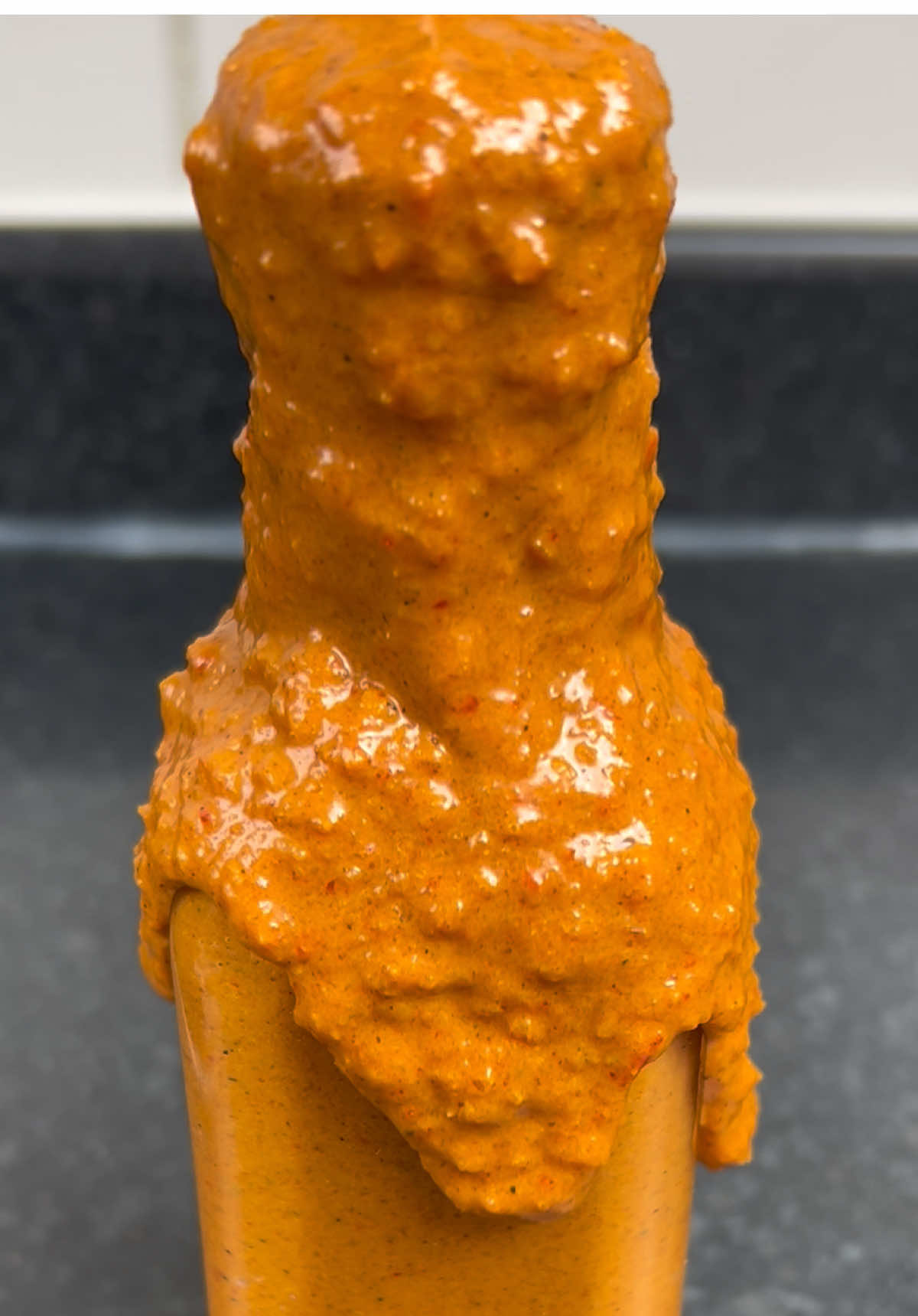 Save the recipe below!  ⬇️ Ingredients:  * Half an onion  * 6/7 red chilis  * 4 garlic cloves  * 2tsp coriander powder  * 2tsp garam massala  * 2tsp curry powder  * 2tsp paprika  * 2tsp turmeric  * 2tsp sugar  #fyp #hotsauce #tikkamassala 