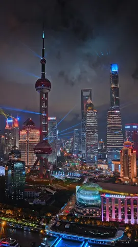 Light, energy, endless motion—Shanghai's nightscape redefines urban wonder. 🌉 Where tradition and future glow side by side. #Shanghai #NeonCity #China #Travel #Traveltips 