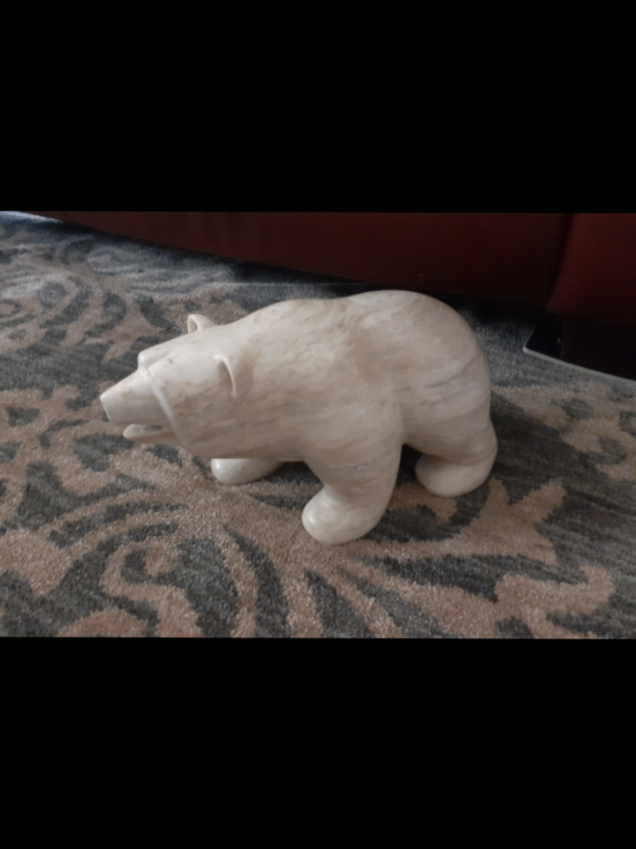 In honor of fat bear week I wanted to post my own. My dad got it for my mom years ago. And by got I mean he had a habit of when drunk and walking home if he saw something he thought my mom would like he would take it, in most cases a flower or two from someones yard. In this case it was a heavy marble bear, which he carried home drunk in the middle of the night. We've had it as long as I can remember and he's been through multiple moves with me and my mom. He mostly guards our doors and keeps them open for us, and on the occasion attacks someones toes because they didnt see him. I should add the fact that this thing is actually 15 pounds, weighed him abd everything, he our chonky lad.  #fatbear #marb #marblepolarbear #drunkdadsdoingthings 