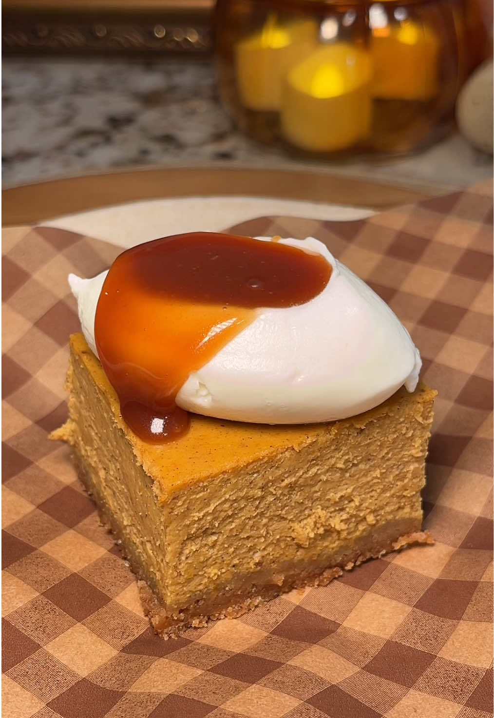 Pumpkin spice cheesecake bars with salted caramel 🎃 A little sweet, a little salty, a lot of pumpkin 🧡 these cheesecake bars are so creamy and packed with your favorite pumpkin and fall spice flavors. Serve with a dollop of whipped cream and warm salted caramel and you’ll have the dreamiest slice of heaven!  For The Graham Crust   * 1 3/4 cups (about 180g) graham cracker crumbs * 1/4 cup plus 2 tbsp (75g) granulated sugar * 8 tablespoons (113g) unsalted butter, melted * Pinch of salt For The Pumpkin Cheesecake * 24 ounces cream cheese, room temperature * 1 cup (220g) brown sugar * 4 eggs, room temperature * 1 Tablespoon ground cinnamon * 1 1/2 teaspoons ground ginger * 1/2 teaspoon ground nutmeg * 1/2 teaspoon ground all spice * 1/4 teaspoon ground cloves * 15 ounces pumpkin puree (1 can) * 1/4 cup (75g) greek yogurt * 1 Tablespoon vanilla extract Toppings * Salted caramel sauce (video posted on 9/6)  * whipped cream  * flaky sea salt (optional) All ovens are not the same. To know when your cheesecake is done, the edges should be set and the center should jiggle only the slightest. Baking it too firm can make your cheesecake dry in texture. #pumpkinspice #cheesecake #bakingrecipe #bakingtiktok #pumpkinseason 