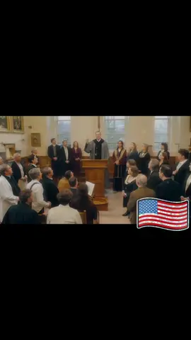 Picture: The believers sat down softly. Some people clasped their hands and bowed their heads to pray silently. The priest stood in front of the podium and smiled. The camera closed up the peaceful faces of several believers. ◦ Voice: The priest's gentle opening words (