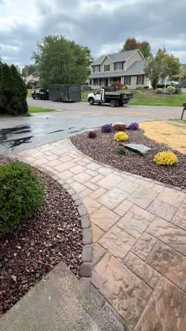 Goodbye outdated front yard 👋 Hello stunning walkway + landscaping 🌸  . www.timmurphylandscaping.com . 📱315.247.5080 . 🗓️ BOOKING FALL 2025 🗓️  . #landscape #hardscape #pavers #backyard #patio         .