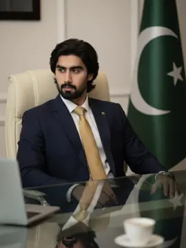 1: Open Gemini  2: Upload your photo  3: Paste the Prompt👇🏻 A cinematic portrait of an Pakistan politician in a modern executive chair upholstered in cream leather, positioned behind a glass-top desk with chrome edges. Shot from a slightly low-angle perspective to convey power and leadership, he wears a dark navy suit with a golden tie, his gaze fixed firmly to the side with a serious demeanor. The flag is displayed proudly in the background. The scene is lit with soft, cinematic lighting, highlighting facial details, the glossy reflections of the glass desk, and the textures of the suit. A blurred laptop and coffee cup in the foreground add realism and depth. Don’t change the face. #chatgpt #gemini #prompt #edit #fppppppppppppppppppp 