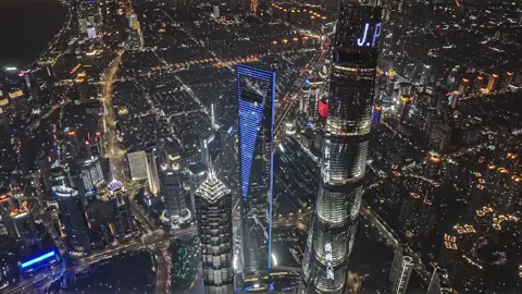 Shanghai's nightscape: a neon river flowing through canyons of glass and steel.🌃 Where skyscrapers become constellations and the city breathes light.  #Shanghai #FutureCity #Travel #Traveltips #China 
