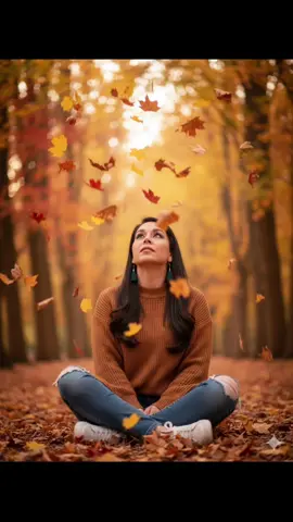 Crea Retrato de esta mujer en otoño, respetando el rostro y rasgos faciales de la fotografía original usando un suéter tejido color marron, pantalon jeans roto moderno y tenis blancos. rostro levantado mientras hojas amarillas, naranjas, marron y rojas caen alrededor de ella, ella esta sentada en el suelo, Fondo desenfocado de árboles otoñales en tonos cálidos, creando un ambiente mágico y vibrante. Fotografía nítida, estilo natural, con efecto de hojas en movimiento alrededor del sujeto.#Gemini #Geminigogle#Geminiotoño