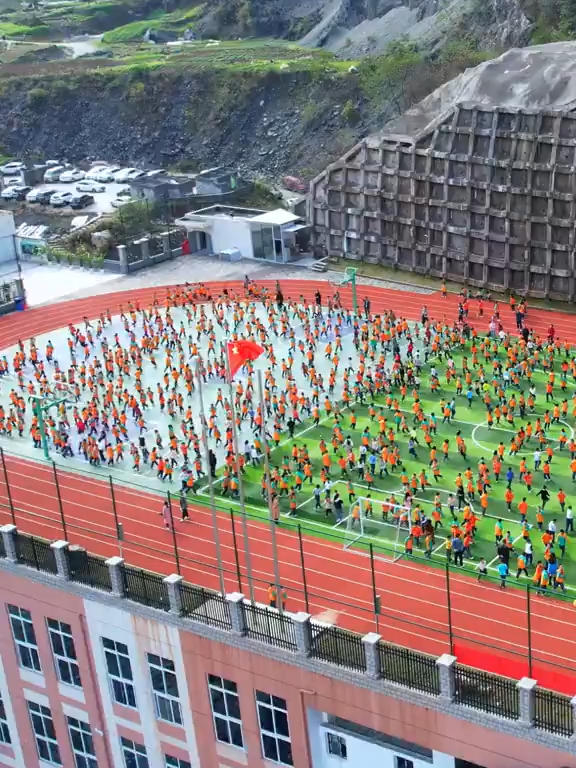 In Chongqing Municipality, the school playground can be built on the rooftop due to the geography.