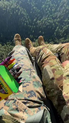 There is nothing like flying in a helo with your feet hanging out the door  And of course, eating crayons. I like the red ones!👍 #helo #aviation #marines #crayons 