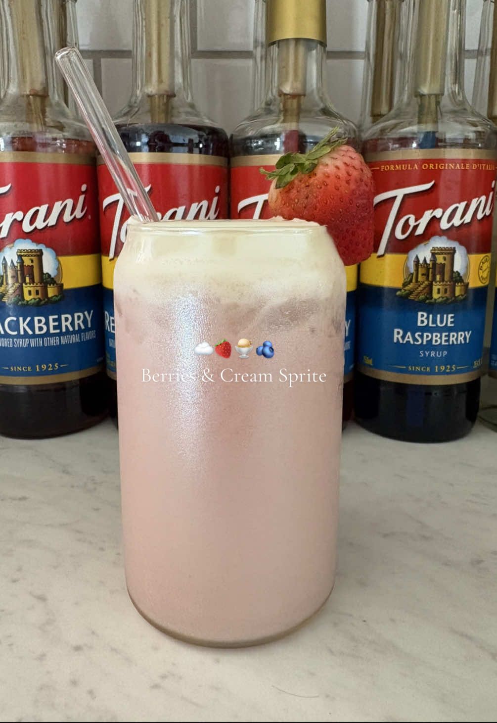 🍓🍨🫐 Berries & Cream Sprite _____________________________ Base: -ice -1/2 can of Sprite  -drizzle of Strawberry purée  -1/2 pump of Blackberry Torani Syrup -1/2 pump of Red Raspberry Torani Syrup -1/2 pump of Strawberry Torani Syrup -1/2 pump of Blue Raspberry Torani Syrup -1 tbsp vanilla cream Cold foam: -2 tbsp vanilla cream Garnish: -drizzle of Strawberry Purée  -strawberry  #dirtysoda #dirtysprite #dirtysodarecipe #torani #berriesandcream  @Sprite @Torani 