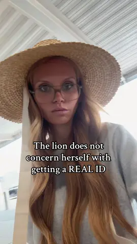 the lion still uses an enlarged photocopy of her drivers license 