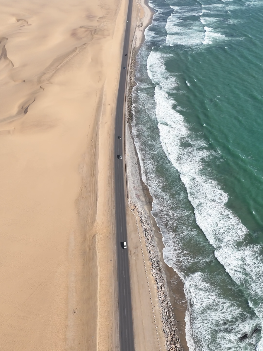 Welcome to Namibia’s coastline — one of the only places in the world where the desert collides with the ocean. #swakopmund #walvisbay #hookedtoexplore #namibia #desertmeetsocean 