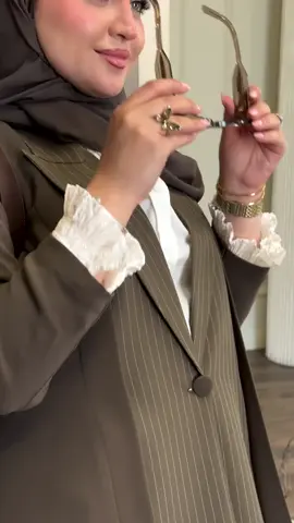 This abaya is all about the details — from its sharp collar cut that speaks sophistication, to the earthy olive tone that radiates timeless class. Crafted with premium fabric for a graceful fall, and finished with intricate detailing that makes it truly unforgettable. A perfect blend of modern chic and modest luxury. 🌿🤍 #ModestFashion#abaya#sgmodestwear #viral #fyp 